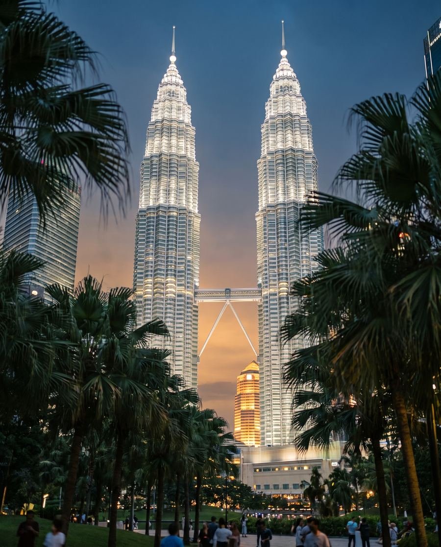 The Petronas Twin Towers in Kuala Lumpur at dusk.