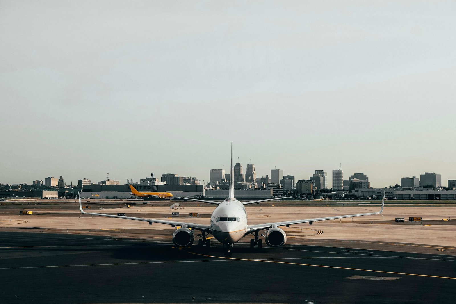 A passenger aircraft seen head-on on an airport taxiway.