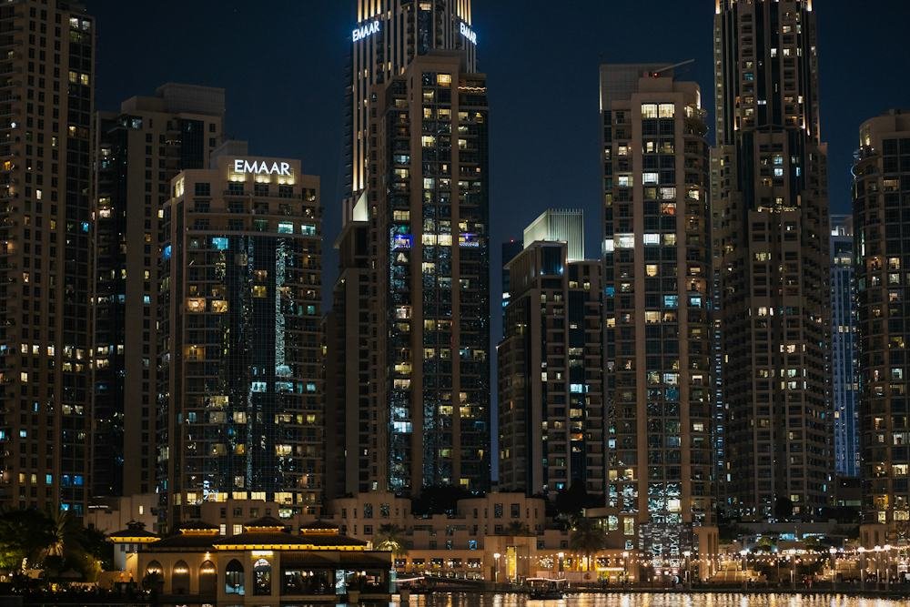 Downtown Dubai's towers lit up at night.